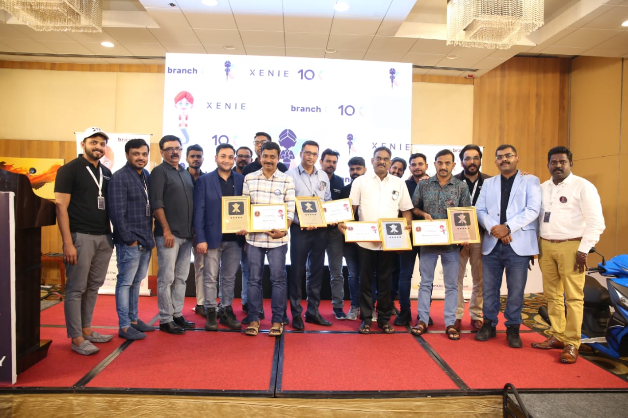 Retailers receiving recognition awards at a BranchX Xenie event