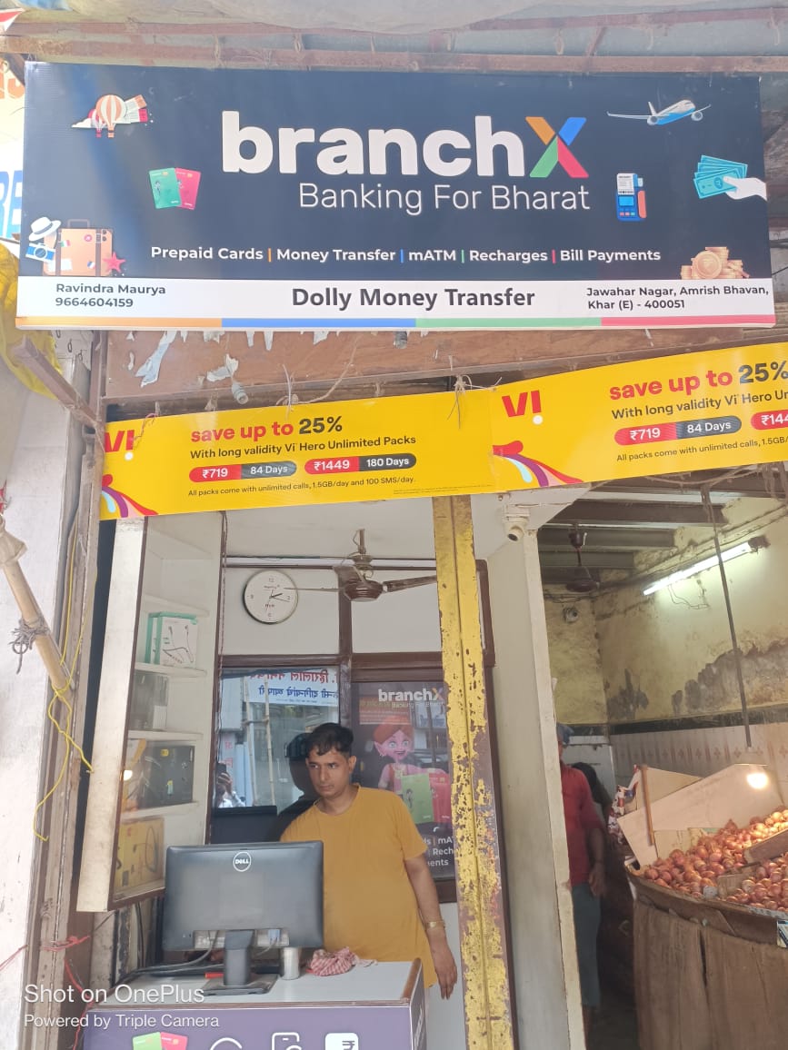 Store operator working at a BranchX-branded money transfer outlet